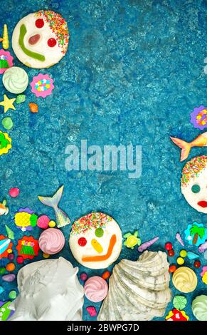 Beach theme flatlay with shells, fish tails, summer party icons