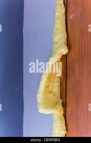 Insulating expanding foam sealant that has expanded from a door frame. Stock Photo
