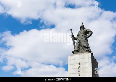 Gwanghwamun Square, Seoul, South Korea - February 27, 2020: Admiral Yi Sun-shin statue with blue sky and clouds background Stock Photo