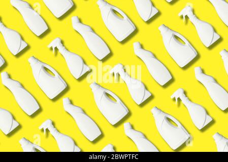 Plastic bottles pattern of cleaning products on yellow background. Plastic waste. Detergent bottle pattern. Chemical cleaning supplies. Stop plastic, Stock Photo