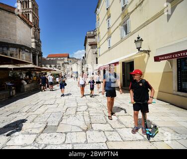 Walking through the narrow old streets of the Diocletians Palace in Split, Croatia. Stock Photo