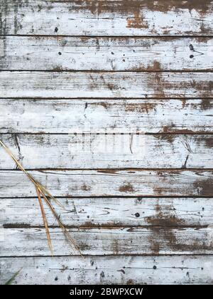 Vintage wooden white and brown background - old wooden bridge or palisade fence. Weathered planks texture. Vertical composition Stock Photo