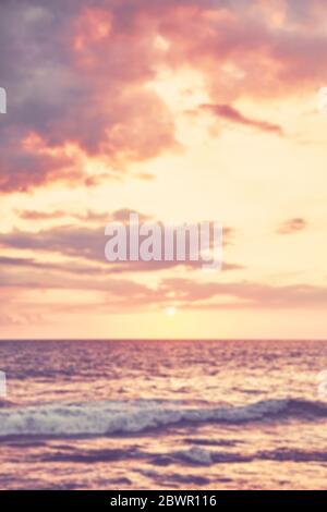 Blurred picture of ocean at sunset, summer vacation background. Stock Photo