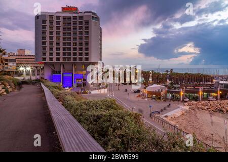 View of the harbour and Carlton hotel at dusk, Jaffa visible in the background, Tel Aviv, Israel, Middle East Stock Photo