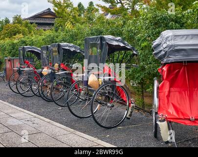 KYOTO, JAPAN - OCTOBER 18, 2019: A pulled rickshaw carts (or ricksha) parked on the street of old Kyoto. Kyoto. Japan Stock Photo