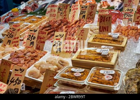 KYOTO, JAPAN - OCTOBER 19, 2019:  Closeup view of different kind of Japanese fresh and fried seafood at the Kyoto market. Japan Stock Photo