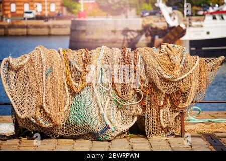 Fishing net hanging to dry near the sea in Croatia Stock Photo - Alamy