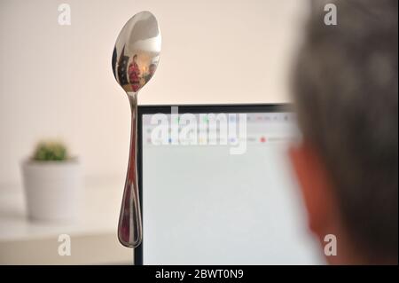 Concept Privacy Protection From Spoon On Monitor Screen Stock Photo