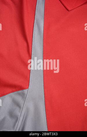 Red and grey jersey fabric texture background, sports wear background. Stock Photo