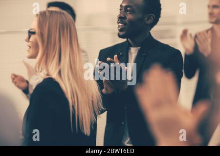 close up. participants of the international business seminar give a standing ovation Stock Photo