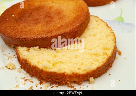 Making sponge cake. Cut in half. Close-up. Top view. Horizontal shot. Stock Photo