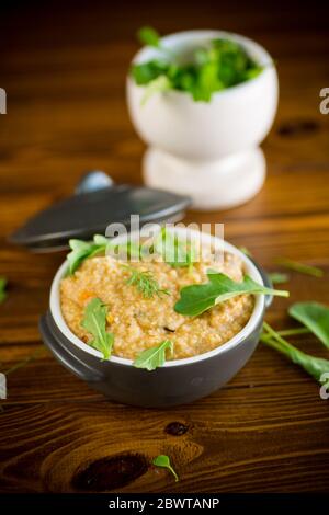 boiled bulgur groats with vegetables and herbs Stock Photo