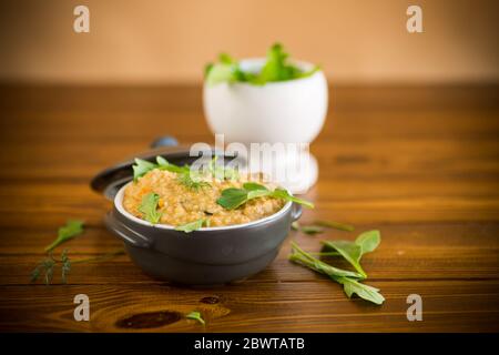 boiled bulgur groats with vegetables and herbs Stock Photo