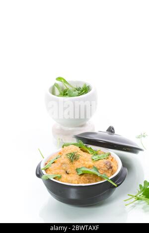boiled bulgur groats with vegetables and herbs Stock Photo