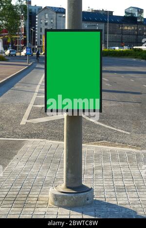 Chroma key Blank billboard and outdoor advertising. Mockup poster outside. Trash in the city on a lamppost, a place for advertising. Stock Photo