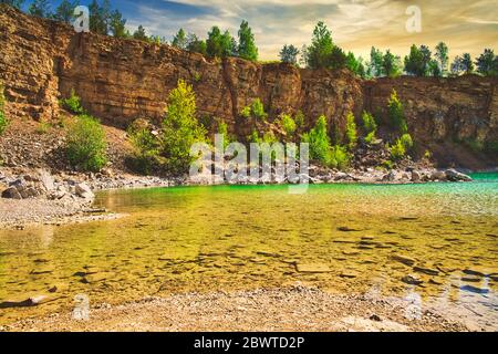 Azure lake. The concept of landscape and relaxing in the fresh air. Trukus water reservoir, attraction and a beautiful place to spend free time. Beaut Stock Photo