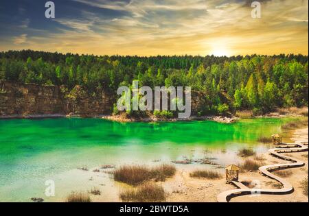 A turquoise lake on sunset. Travel and rest concept. Wonderful views and extraordinary places on earth, sunrise. Stock Photo