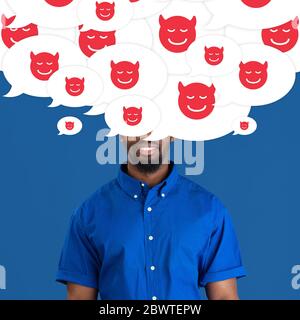 What's in your head. Young man with big speech bubbles on his head like a hairstyle made of devil's smiles. Creative contemporary artwork. Daily thoughts, bulling, abusing, bad thoughts visible. Stock Photo