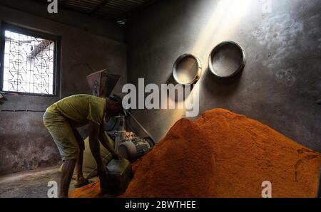 Kathmandu, Nepal. 3rd June, 2020. A man collects turmeric powder after grinding for further processing at a mill during nationwide lockdown amid COVID-19 outbreak in Kathmandu, capital of Nepal on June 3, 2020. Credit: Sunil Sharma/ZUMA Wire/Alamy Live News Stock Photo