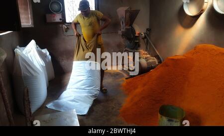 Kathmandu, Nepal. 3rd June, 2020. A man pours prepared turmeric powder in sacks at a mill, to take them in market during nationwide lockdown amid COVID-19 outbreak in Kathmandu, capital of Nepal on June 3, 2020. Credit: Sunil Sharma/ZUMA Wire/Alamy Live News Stock Photo