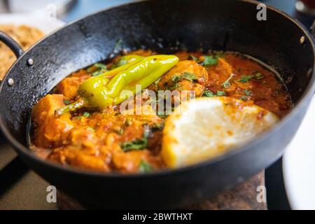 Indian Curry food photography close up - Balti curry, Chicken and chilli hot and spicy with lime and garnish Stock Photo