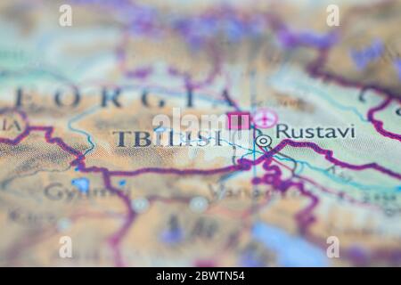 Shallow depth of field focus on geographical map location of Tbilisi city Georgia Europe continent on atlas Stock Photo
