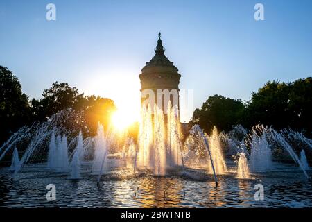 Germany, Baden-Wurttemberg, Mannheim, Wasserturm fountain at sunset Stock Photo