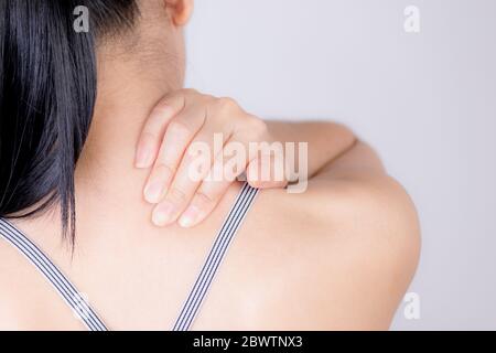 Closeup asian woman neck and shoulder pain and injury. Health care and medical concept. Stock Photo