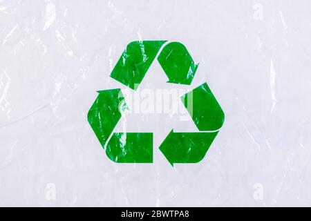 Recycle symbols cover with plastic sheets on white table background . World Environment day concept. Reuse, Recycle concept. Stock Photo