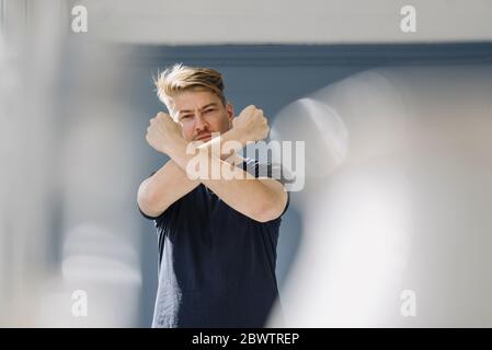 Portrait of a bearded man crossing his arms Stock Photo