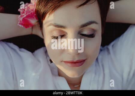 Portrait of woman wearing fringed tulip Stock Photo