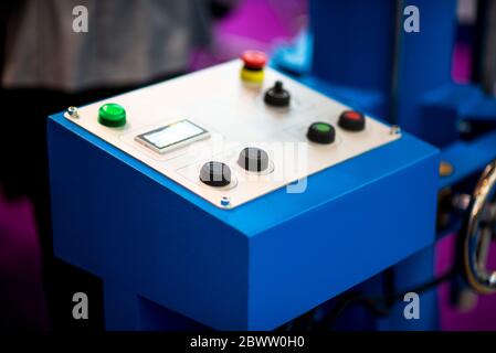 The red emergency button or stop button for Hand press. STOP Button for industrial machine, Emergency Stop for Safety. Stock Photo