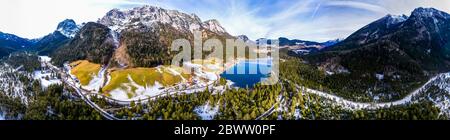 Germany, Bavaria, Ramsau bei Berchtesgaden, Helicopter view of Hintersee lake and Reiter Alpe range at winter dawn Stock Photo