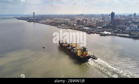 Mozambique, Maputo, Aerial view of container ship leaving city Stock Photo