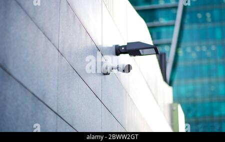 three cctv security cameras on the street pylon Stock Photo