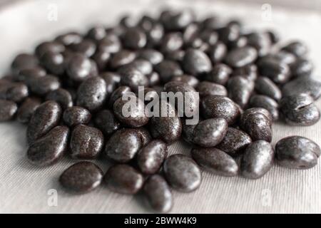 a bunch of sweets close-up. chocolate raisins in bulk. sweet background Stock Photo