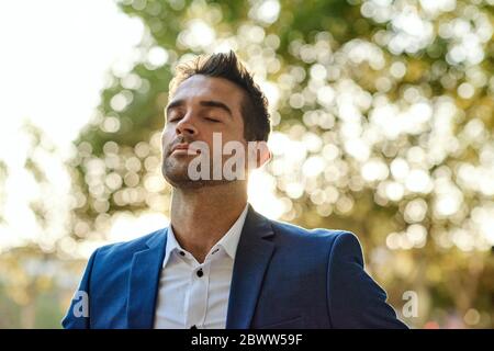 Young businessman getting some fresh air during his business day Stock Photo