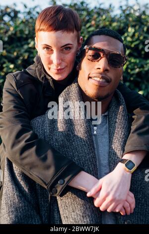 Portrait of happy young couple outdoors Stock Photo