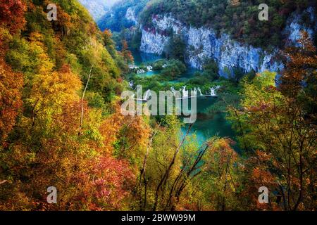 Croatia, Scenic view of lake surrounded by autumn forest in Plitvice Lakes National Park