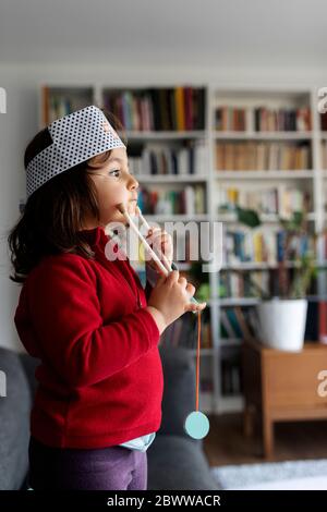 Girl playing with stethoscope Stock Photo