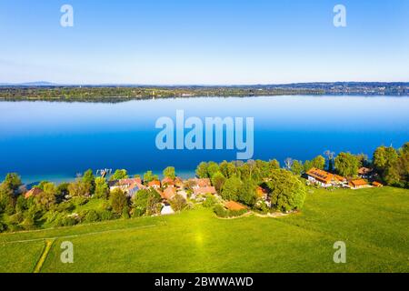 Germany, Bavaria, Munsing, Drone view of village at shore of Lake Starnberg in spring Stock Photo