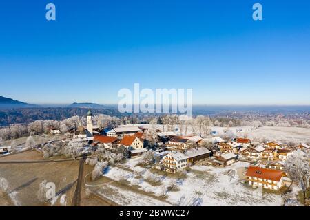 Germany, Bavaria, Gaissach, Drone view of clear sky over snow-covered village Stock Photo