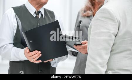 close up. businesswoman discussing work plan with her colleagues Stock Photo