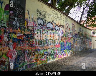 The Lennon Wall or John Lennon Wall in Prague - Praha, Czech Republic. Graffiti inspired by John Lennon and the Beatles has been painted here since th Stock Photo