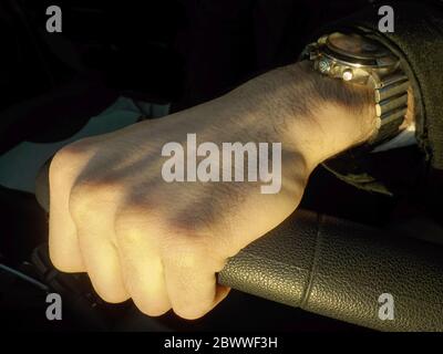 Man hand on the steering wheel Stock Photo