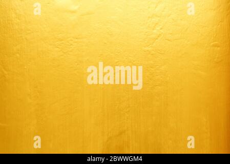 Old Grunge Golden Painting on Wood Wall Background with Light Leak on Top. Stock Photo