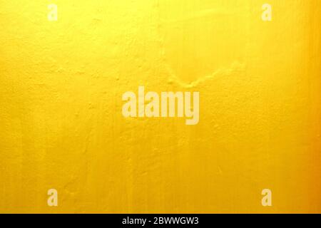 Old Grunge Golden Painting on Wood Wall Background with Light Leak on Top. Stock Photo