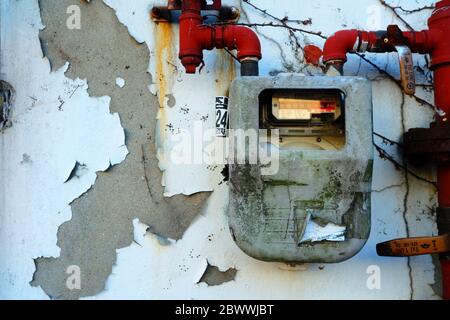 SEOUL, SOUTH KOREA - DECEMBER 24, 2018: Old household gas meter on grunge concrete wall for measuring consumption. Stock Photo