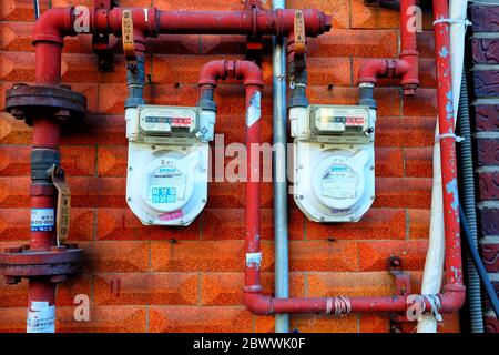 SEOUL, SOUTH KOREA - DECEMBER 24, 2018: Old household gas meter on grunge concrete wall for measuring consumption. Stock Photo