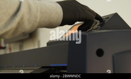 Industrial worker input data programing for CNC milling machine. Stock Photo